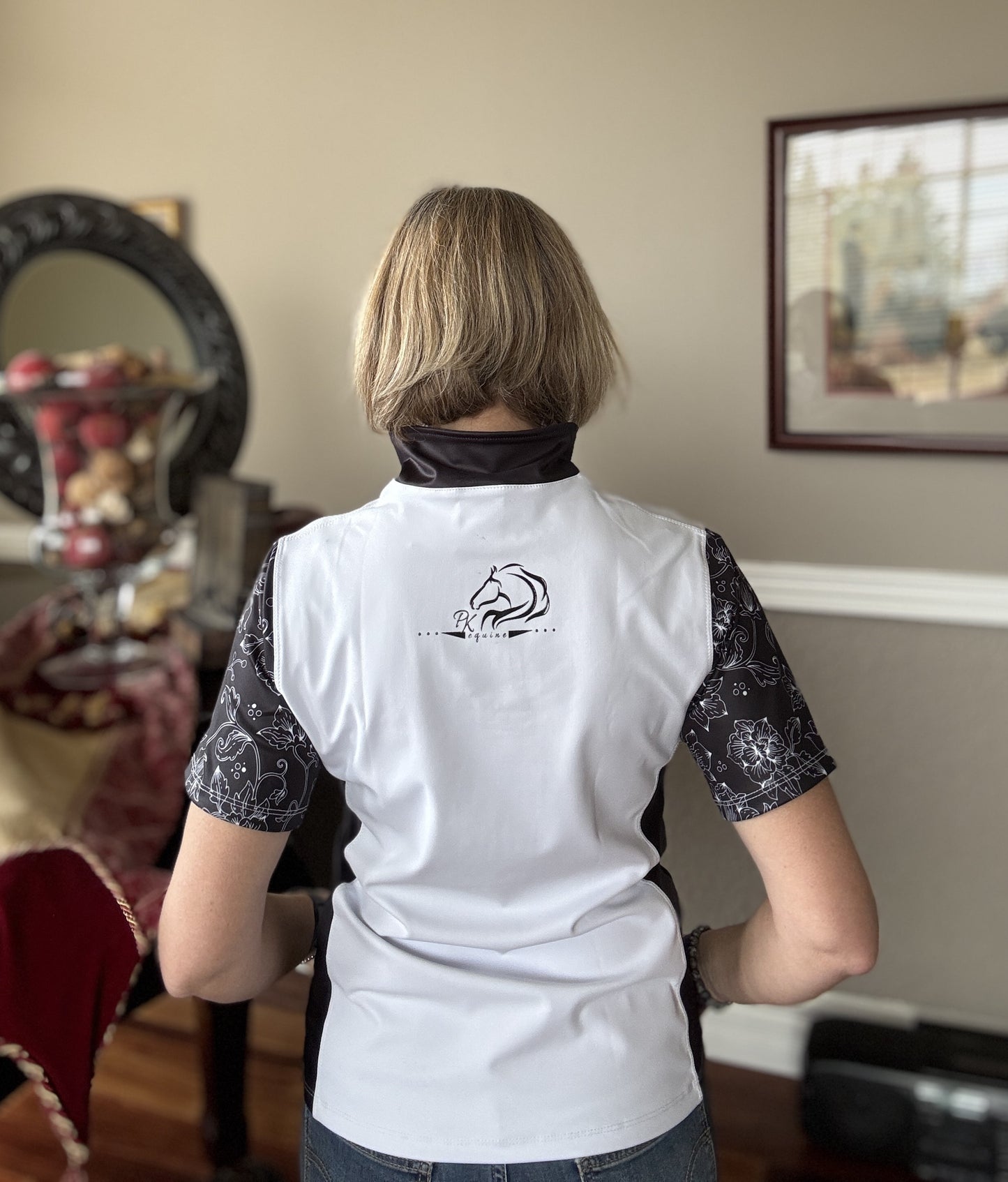 Women’s floral half-zip riding top in breathable, stretchy fabric with floral sleeves by PK Equine