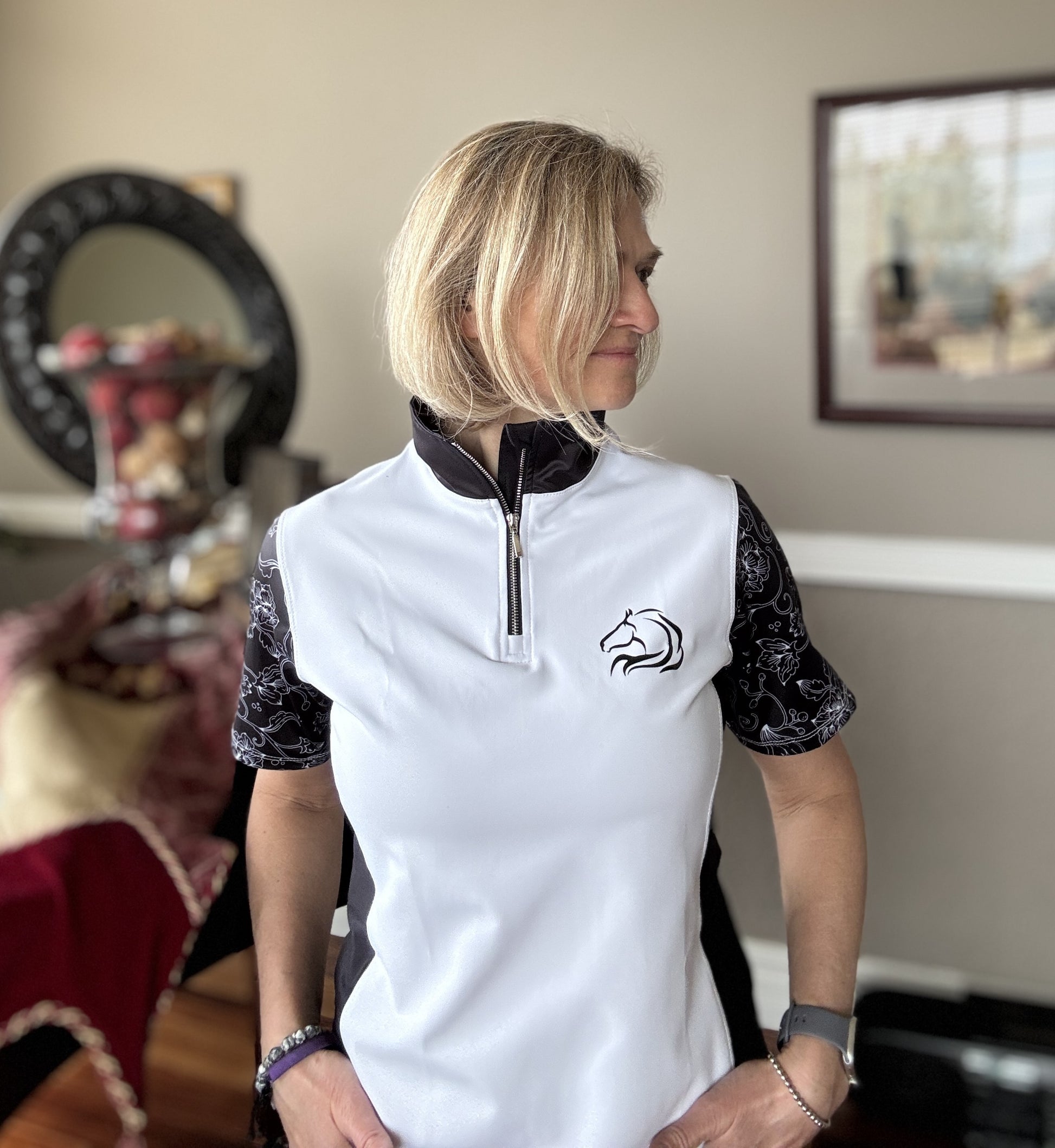 Women’s floral half-zip riding top in breathable, stretchy fabric with floral sleeves by PK Equine