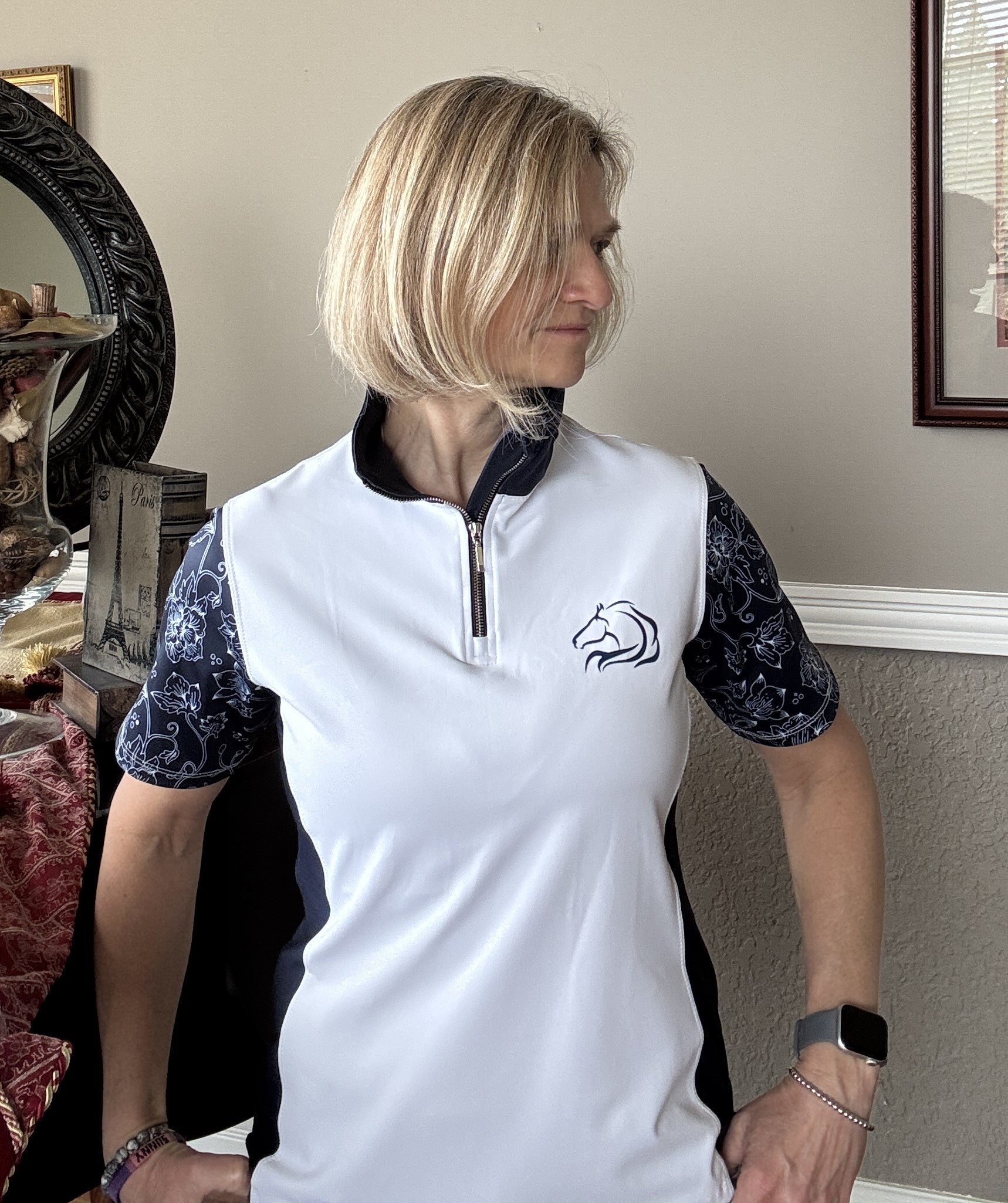 Women’s floral half-zip riding top in breathable, stretchy fabric with floral sleeves by PK Equine